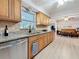 Kitchen with granite countertops, stainless dishwasher and view of the living room at 4100 Narvarez S Way, St Petersburg, FL 33712