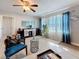 Bright living room featuring ample natural light, wood floors, modern decor, and an accent chair at 4100 Narvarez S Way, St Petersburg, FL 33712