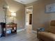 Cozy living room featuring wood floors, soft lamps and decorative side tables, and an open floor plan at 4100 Narvarez S Way, St Petersburg, FL 33712
