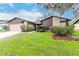 Charming one-story home with neutral exterior and landscaped front yard at 415 Bloomingfield Dr, Brandon, FL 33511