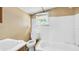 Image of a bathroom needing renovation with damaged walls, outdated tub and toilet at 4804 N 10Th St, Tampa, FL 33603