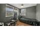 Bedroom with tile flooring, dark colored walls, natural light, and ceiling fan at 4804 N 10Th St, Tampa, FL 33603