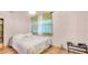 This bedroom features laminate floors, a closet, and natural lighting at 4804 N 10Th St, Tampa, FL 33603