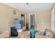 This bedroom contains boxes, an old television and some storage containers at 4804 N 10Th St, Tampa, FL 33603