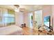 This bedroom features laminate floors, a closet, and natural lighting at 4804 N 10Th St, Tampa, FL 33603