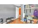View of hallway with closet storage, grey walls, and doorway leading to another room at 4804 N 10Th St, Tampa, FL 33603