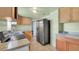 The kitchen features granite countertops, stainless steel appliances, and wood cabinets at 4804 N 10Th St, Tampa, FL 33603