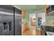 Kitchen with black appliances, wooden cabinets, tile flooring, and open design at 4804 N 10Th St, Tampa, FL 33603
