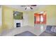 Bright and airy living area with fireplace, tile flooring, and open layout at 4804 N 10Th St, Tampa, FL 33603
