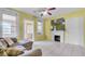Bright living room featuring tile floors, fireplace, and neutral paint scheme at 4804 N 10Th St, Tampa, FL 33603