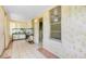 Light-filled sunroom with tile flooring, offering a cozy and bright space at 4804 N 10Th St, Tampa, FL 33603