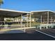 View of the shuffleboard courts with a covered seating area in a well-maintained community at 4851 W Gandy Blvd # 14C, Tampa, FL 33611