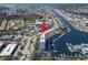 Aerial view of the condo and waterway showcasing waterfront living and community amenities at 4939 Floramar Ter # 208, New Port Richey, FL 34652