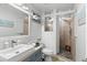 Renovated bathroom with tiled shower and modern fixtures at 4939 Floramar Ter # 208, New Port Richey, FL 34652