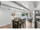 Bright kitchen with stainless appliances open to the living space and offers a cozy dining area at 4939 Floramar Ter # 208, New Port Richey, FL 34652