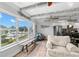 Bright living space with waterfront views blends seamlessly into a modern, stylish kitchen area at 4939 Floramar Ter # 208, New Port Richey, FL 34652