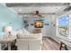Inviting living room offers comfortable seating, modern entertainment, and scenic waterfront views at 4939 Floramar Ter # 208, New Port Richey, FL 34652