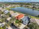 Scenic aerial view of neighborhood featuring waterfront properties, mature trees, and well-maintained landscaping at 5124 Clover Mist Dr, Apollo Beach, FL 33572