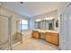 Spacious bathroom with dual sink vanity, a glass enclosed shower and a soaking tub at 5124 Clover Mist Dr, Apollo Beach, FL 33572