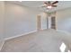 Large bedroom featuring plush carpet, neutral paint, and a ceiling fan at 5124 Clover Mist Dr, Apollo Beach, FL 33572