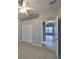 Carpeted bedroom with standard closet, ceiling fan, and open doorway to the tiled hallway at 5124 Clover Mist Dr, Apollo Beach, FL 33572