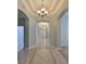 Elegant foyer with decorative tile flooring, arched doorways, and stylish lighting at 5124 Clover Mist Dr, Apollo Beach, FL 33572