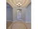 Elegant foyer with decorative tile flooring, arched doorways, and stylish lighting at 5124 Clover Mist Dr, Apollo Beach, FL 33572