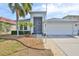 Inviting home with a two-car garage, screened entry and landscaped front yard at 5124 Clover Mist Dr, Apollo Beach, FL 33572