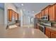 Bright kitchen with stainless appliances, bar-style counter, and stone tile backsplash at 5124 Clover Mist Dr, Apollo Beach, FL 33572