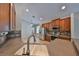 Modern kitchen features stainless steel appliances and brown cabinetry at 5124 Clover Mist Dr, Apollo Beach, FL 33572