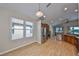 Bright eat in kitchen with stainless steel appliances, wood cabinets, and wood floors at 5124 Clover Mist Dr, Apollo Beach, FL 33572