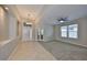 Open living room featuring neutral paint, carpet, tile floors and bright windows at 5124 Clover Mist Dr, Apollo Beach, FL 33572
