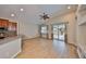 Open living room with wood floors, ceiling fan, and sliding glass doors to the patio at 5124 Clover Mist Dr, Apollo Beach, FL 33572