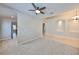 Spacious living room featuring neutral paint, plush carpet, arched doorways, and recessed lighting at 5124 Clover Mist Dr, Apollo Beach, FL 33572