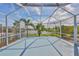 The screened patio has a picturesque view of the nearby pond and landscaping at 5124 Clover Mist Dr, Apollo Beach, FL 33572