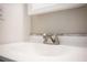 Bathroom sink and faucet with laminate countertops in a neutral color and fresh paint at 6141 Chesham Dr # 7, New Port Richey, FL 34653