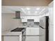 Modern kitchen with granite countertops, stainless steel appliances, and a functional layout at 6141 Chesham Dr # 7, New Port Richey, FL 34653