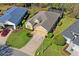 Aerial view showcases the property, landscaping, and the surrounding neighborhood at 10105 Holly Berry Dr, Weeki Wachee, FL 34613