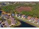 Aerial view of the property in a neighborhood surrounded by conservation areas and waterfront at 10105 Holly Berry Dr, Weeki Wachee, FL 34613
