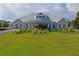 Elegant clubhouse with manicured lawns, offering a grand entrance and welcoming atmosphere at 10105 Holly Berry Dr, Weeki Wachee, FL 34613