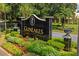 Elegant GlenLakes community entrance sign surrounded by lush landscaping and mature trees at 10105 Holly Berry Dr, Weeki Wachee, FL 34613