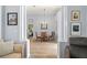Elegant dining room showcasing a glass table, cushioned chairs, and stylish architectural columns at 10105 Holly Berry Dr, Weeki Wachee, FL 34613