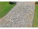 Paver driveway leading up to the attached two-car garage enhances curb appeal at 10105 Holly Berry Dr, Weeki Wachee, FL 34613