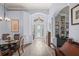 Spacious foyer with arched doorways, elegant columns, and luxury vinyl plank flooring at 10105 Holly Berry Dr, Weeki Wachee, FL 34613