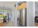 Eat-in kitchen featuring stainless steel refrigerator and breakfast nook at 10105 Holly Berry Dr, Weeki Wachee, FL 34613