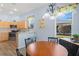 Sunlit breakfast nook adjacent to a charming and well-equipped kitchen at 10105 Holly Berry Dr, Weeki Wachee, FL 34613