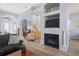 Open concept living space includes fireplace, TV, and stylish decor at 10105 Holly Berry Dr, Weeki Wachee, FL 34613