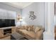 Comfortable living room with a plush couch, TV, and decorative accents at 10105 Holly Berry Dr, Weeki Wachee, FL 34613