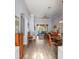 Open-concept living area with luxury vinyl plank floors, archways, and views of the lanai at 10105 Holly Berry Dr, Weeki Wachee, FL 34613