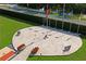 Overhead view of the memorial with benches, flags, and red flowers in a brick setting at 10105 Holly Berry Dr, Weeki Wachee, FL 34613